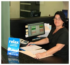 Idania working the front desk of Douglas A. Deam, DMD, PA